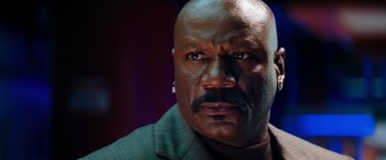 Movie still from “Mission: Impossible III” (2006), directed by J.J. Abrams – A person wearing a suit and tie; Close Up shot, Low angle