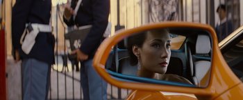 Movie still from “Mission: Impossible III” (2006), directed by J.J. Abrams – A person in a car's side view mirror; Close Up shot, Over the shoulder angle