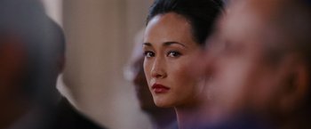 Movie still from “Mission: Impossible III” (2006), directed by J.J. Abrams – A woman's face in a crowd of people; Close Up shot, Over the shoulder angle