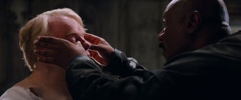 Movie still from “Mission: Impossible III” (2006), directed by J.J. Abrams – A man with his hand on another man's face; Close Up shot, Over the shoulder angle