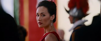 Movie still from “Mission: Impossible III” (2006), directed by J.J. Abrams – A woman in a red dress and a red hat; Close Up shot, Over the shoulder angle
