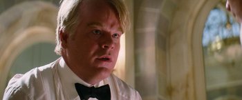 Movie still from “Mission: Impossible III” (2006), directed by J.J. Abrams – A person wearing a bow tie; Close Up shot, Over the shoulder angle