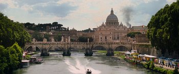Movie still from “Mission: Impossible III” (2006), directed by J.J. Abrams – A view of a bridge with a boat on the water; Extreme Wide shot, Low angle