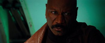 Movie still from “Mission: Impossible III” (2006), directed by J.J. Abrams – A person wearing a brown leather jacket; Close Up shot, Low angle