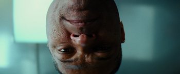 Movie still from “Mission: Impossible III” (2006), directed by J.J. Abrams – A man's face with his eyes closed; Extreme Close Up shot, Low angle