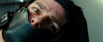 Movie still from “Mission: Impossible III” (2006), directed by J.J. Abrams – A person's face wearing a helmet; Extreme Close Up shot, Overhead angle