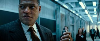Movie still from “Mission: Impossible III” (2006), directed by J.J. Abrams – A person holding a cell phone; Close Up shot, Low angle