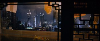 Movie still from “Mission: Impossible III” (2006), directed by J.J. Abrams – A view of a large city from a window at night time; Extreme Wide shot, High angle