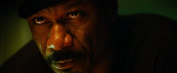 Movie still from “Mission: Impossible III” (2006), directed by J.J. Abrams – A man's face in the dark; Extreme Close Up shot, Low angle
