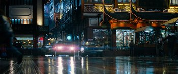 Movie still from “Mission: Impossible III” (2006), directed by J.J. Abrams – A car driving down a street at night; Wide shot, Low angle