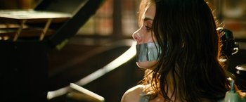 Movie still from “Mission: Impossible III” (2006), directed by J.J. Abrams – A woman with duct tape around her mouth; Close Up shot, Over the shoulder angle
