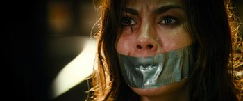 A woman with duct tape over her mouth