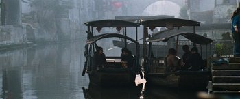 Movie still from “Mission: Impossible III” (2006), directed by J.J. Abrams – A couple of people in a boat on a body of water; Wide shot, High angle