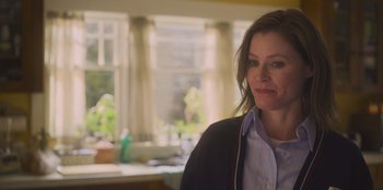 Movie still from “Mixtape” (2021), directed by Valerie Weiss – A person standing in front of a window; Close Up shot, Over the shoulder angle