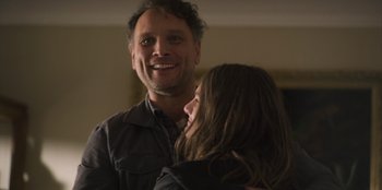 Movie still from “Mixtape” (2021), directed by Valerie Weiss – A man and a woman are smiling at each other; Close Up shot, Over the shoulder angle