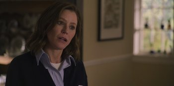Movie still from “Mixtape” (2021), directed by Valerie Weiss – A woman in a blue jacket is looking at the camera; Close Up shot, Over the shoulder angle