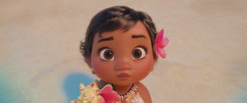Movie still from “Moana” (2016), directed by Chris Williams – A baby moana with a flower in her hair; Close Up shot, High angle