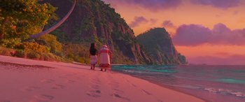 Movie still from “Moana” (2016), directed by Chris Williams – Two people walking on the beach near the water; Extreme Wide shot, High angle