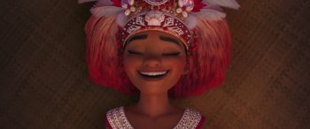 Movie still from “Moana” (2016), directed by Chris Williams – An animated woman wearing a colorful headdress and smiling; Close Up shot, Overhead angle