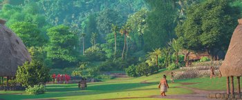 Movie still from “Moana” (2016), directed by Chris Williams – A person walking on a dirt path near a lush green forest; Extreme Wide shot, High angle