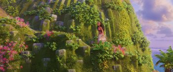 Movie still from “Moana” (2016), directed by Chris Williams – A woman standing on top of a lush green hillside; Extreme Wide shot, Over the shoulder angle