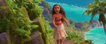 Movie still from “Moana” (2016), directed by Chris Williams – A doll of moana standing in front of a mountain; Wide shot, Low angle