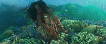 Movie still from “Moana” (2016), directed by Chris Williams – A young girl is swimming in the ocean; Wide shot, High angle