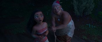 Movie still from “Moana” (2016), directed by Chris Williams – A couple of people standing next to each other in the grass; Medium shot, Over the shoulder angle