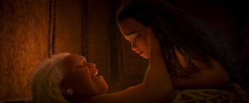 Movie still from “Moana” (2016), directed by Chris Williams – Two young children are looking at each other in the dark; Close Up shot, Overhead angle