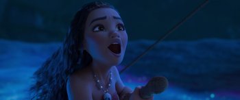 Movie still from “Moana” (2016), directed by Chris Williams – A young girl is singing into a microphone; Close Up shot, High angle
