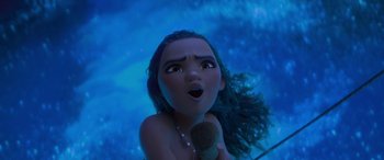 Movie still from “Moana” (2016), directed by Chris Williams – A woman's face with a microphone in her hand; Close Up shot, Low angle