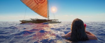 Movie still from “Moana” (2016), directed by Chris Williams – A woman swimming in the ocean next to a sail boat; Extreme Wide shot, High angle