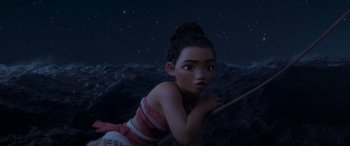 Movie still from “Moana” (2016), directed by Chris Williams – A young woman is looking at the camera while standing on a rope; Medium shot, High angle