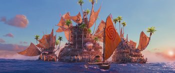 Movie still from “Moana” (2016), directed by Chris Williams – An island with a sail boat floating in the water; Extreme Wide shot, Low angle