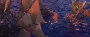 Movie still from “Moana” (2016), directed by Chris Williams – A boat sailing on the ocean next to another boat in the water; Extreme Wide shot, High angle