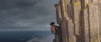 Movie still from “Moana” (2016), directed by Chris Williams – A man and a woman climbing a rock wall; Extreme Wide shot, Low angle