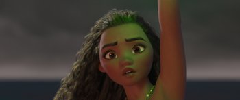 Movie still from “Moana” (2016), directed by Chris Williams – A young woman's face with a green hair; Close Up shot, Low angle