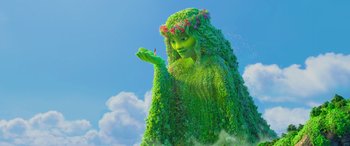 Movie still from “Moana” (2016), directed by Chris Williams – A woman in a green dress made out of plants; Wide shot, Low angle