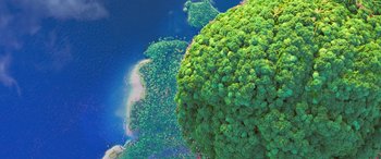 Movie still from “Moana” (2016), directed by Chris Williams – Aerial view of a lush green forest near a body of water; Extreme Wide shot, Overhead angle