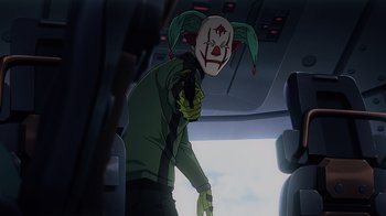 Movie still from “Mobile Suit Gundam: Hathaway” (2021), directed by Shûkô Murase – A person wearing a clown mask and a green jacket; Close Up shot, Over the shoulder angle