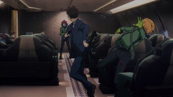 Movie still from “Mobile Suit Gundam: Hathaway” (2021), directed by Shûkô Murase – A man in a suit walking down the aisle of a train; Wide shot, High angle