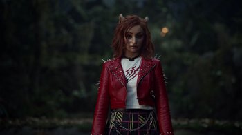 Movie still from “Monster High 2” (2023), directed by Todd Holland – A woman wearing a red jacket and a white shirt; Medium shot, Over the shoulder angle