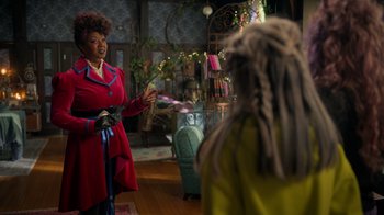 Movie still from “Monster High 2” (2023), directed by Todd Holland – A woman in a red dress talking to a woman in a yellow dress; Medium shot, Over the shoulder angle