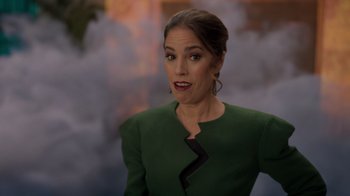 Movie still from “Monster High 2” (2023), directed by Todd Holland – A person wearing a green dress; Medium shot, Over the shoulder angle