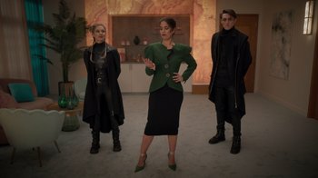 Movie still from “Monster High 2” (2023), directed by Todd Holland – A group of people standing around in a room; Wide shot, Over the shoulder angle