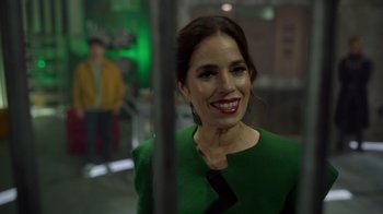 Movie still from “Monster High 2” (2023), directed by Todd Holland – A woman in a green dress smiling for the camera; Close Up shot, Over the shoulder angle