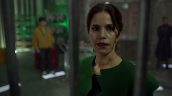 Movie still from “Monster High 2” (2023), directed by Todd Holland – A woman in a green dress is standing in front of a mirror; Close Up shot, Over the shoulder angle