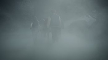 Movie still from “Monster High 2” (2023), directed by Todd Holland – A group of people walking in the fog on a trail; Wide shot, High angle