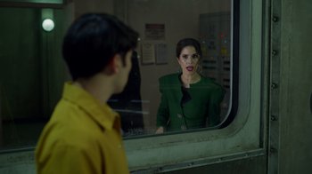 Movie still from “Monster High 2” (2023), directed by Todd Holland – A man and a woman looking at each other through a train window; Medium shot, Over the shoulder angle