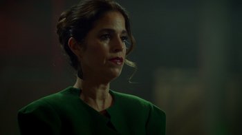 Movie still from “Monster High 2” (2023), directed by Todd Holland – A person wearing a green dress; Close Up shot, Over the shoulder angle